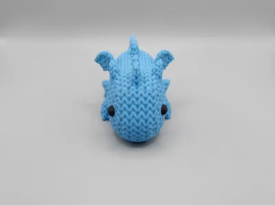Cute knitted little dragon
