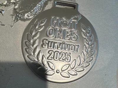 Hot Ones Challenge survivor medal