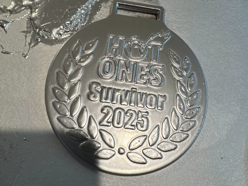 Hot Ones Challenge survivor medal