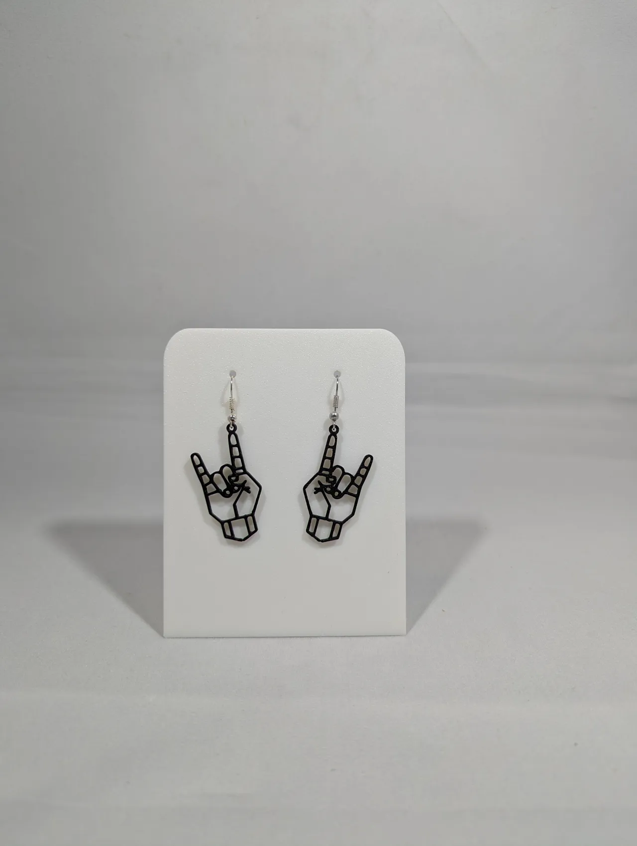 Metal hand earrings view 4