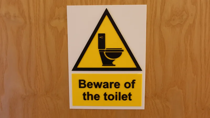 Beware of the toilet sign