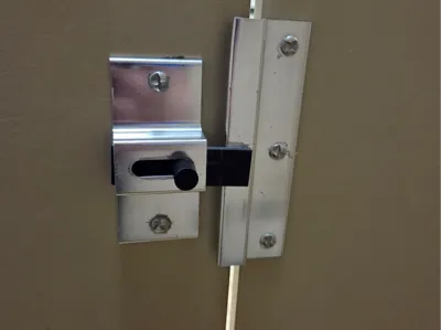 Sliding bar lock for bathroom stall door