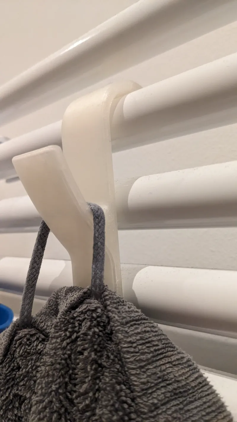 Towel hook for heater