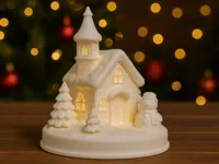 Leuchtende Winterkirche mit Schneemann