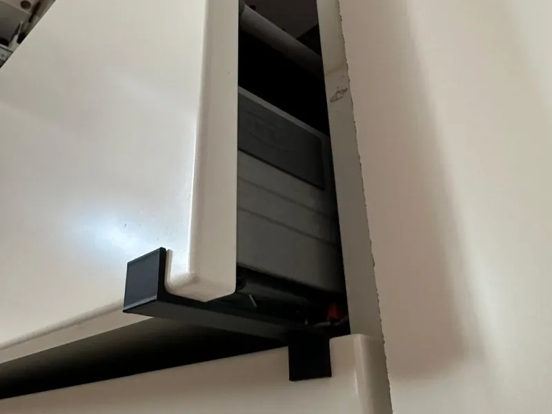 soporte para mantener el cajón superior abierto