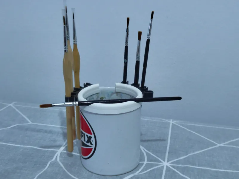 Paint brush holder for cups