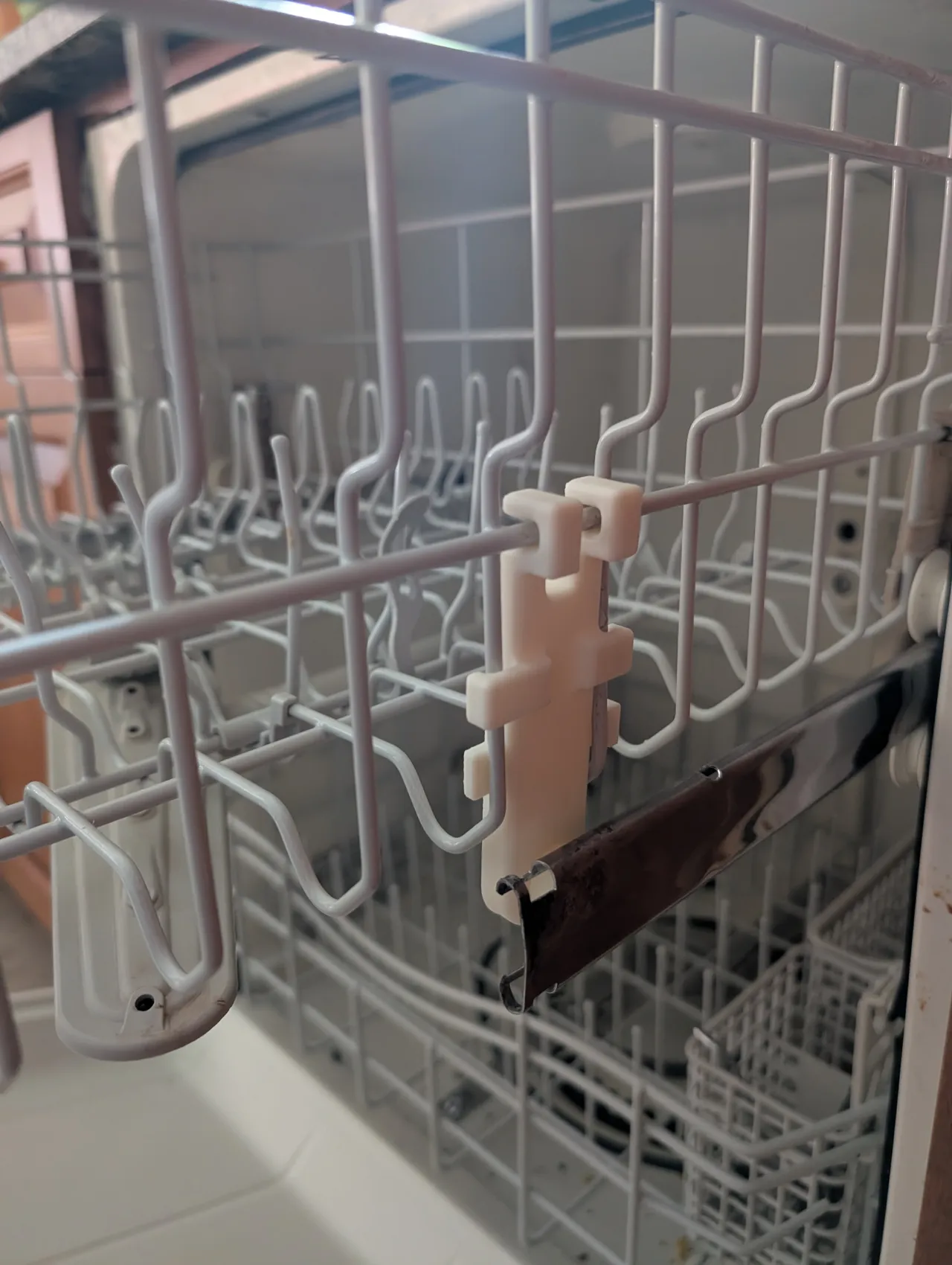 old dishwasher roller bracket repair view 3