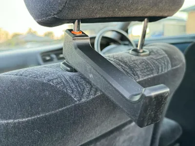 Car head rest holder with multi-fit sleeve