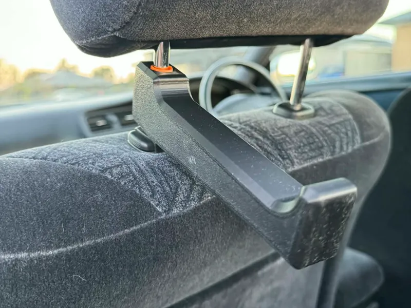 Car head rest holder with multi-fit sleeve