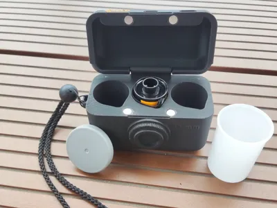 Film case 35 mm (camera shape) with strap eyelet 
