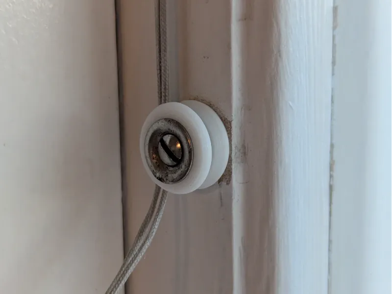Window blind string holder 