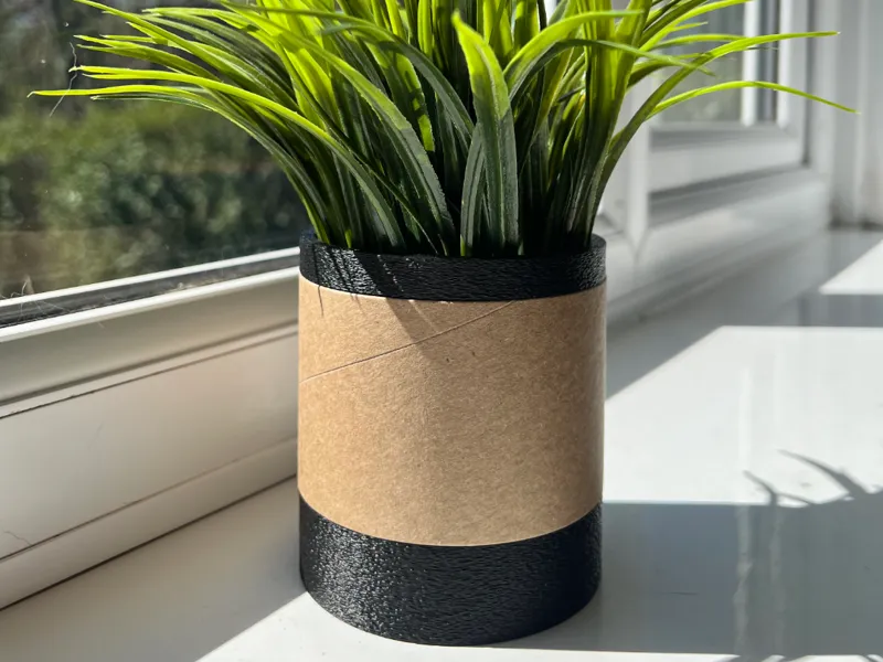 Modern planter / pen holder with decorative spool