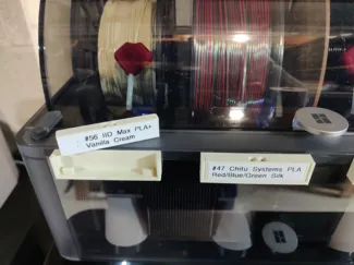 All-in-one AMS filament label and spool keeper
