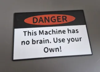 Danger Sign: This machine has no brain.