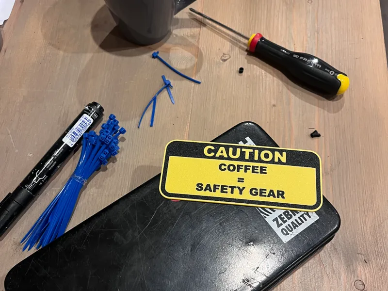 Caution sign – coffee is  safety gear