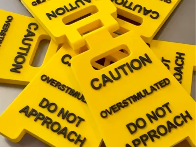 Overstimulated desk sign