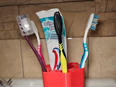 Relvolver style toothbrush holder