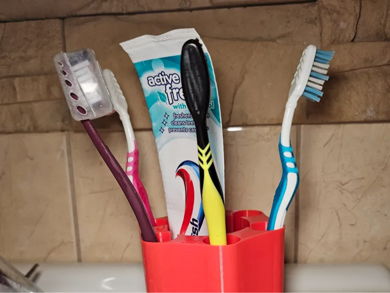 Relvolver style toothbrush holder