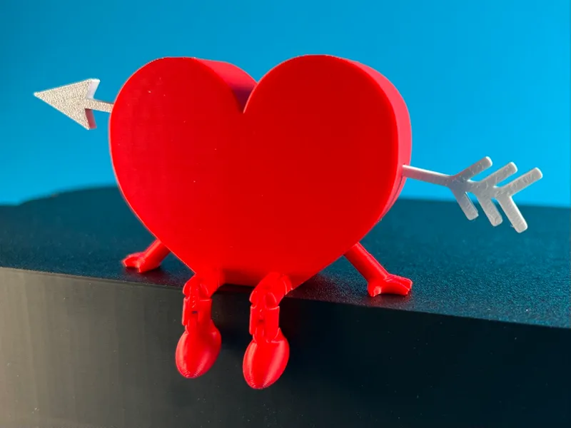 Articulated heart buddy pierced by an arrow
