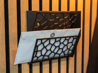 Wall-mounted letter holder with two compartments
