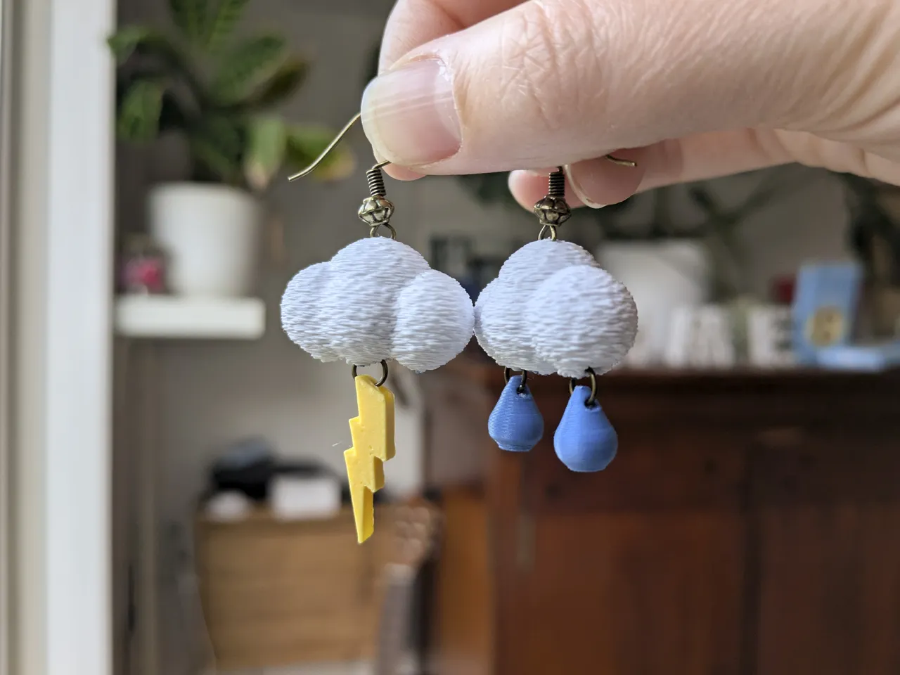 Cloud earrings with lightning bolt and raindrops view 4