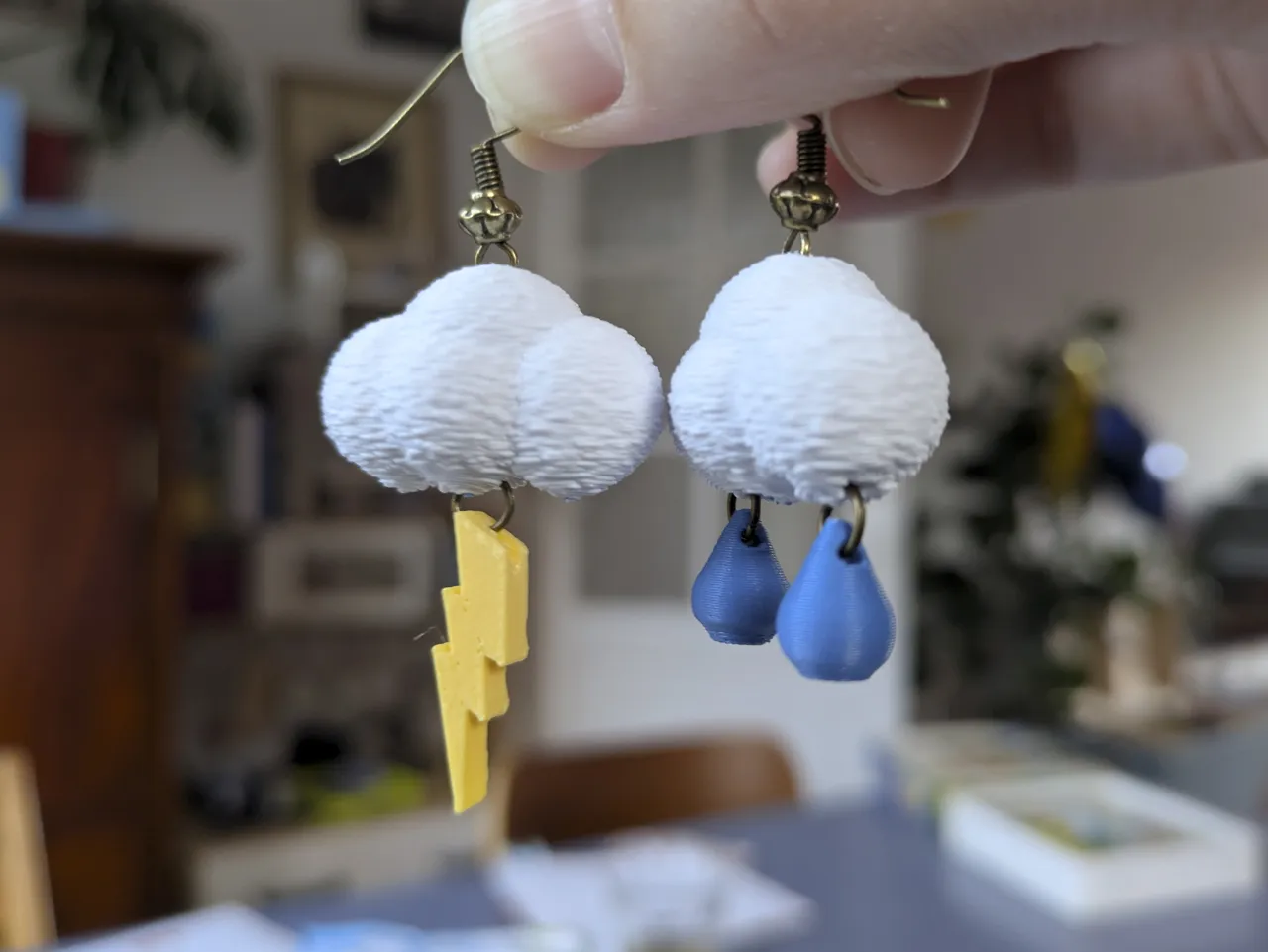 Cloud earrings with lightning bolt and raindrops view 2