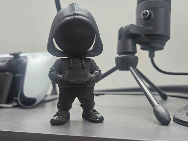 suspicious hooded figure with articulated head