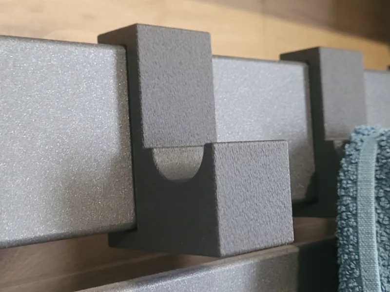 Stylish designer towel hook for wall radiator