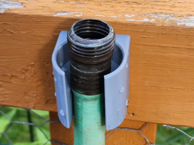 Garden hose end holder