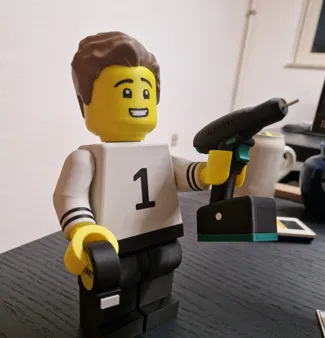 Worker brick man with drill and measuringtape
