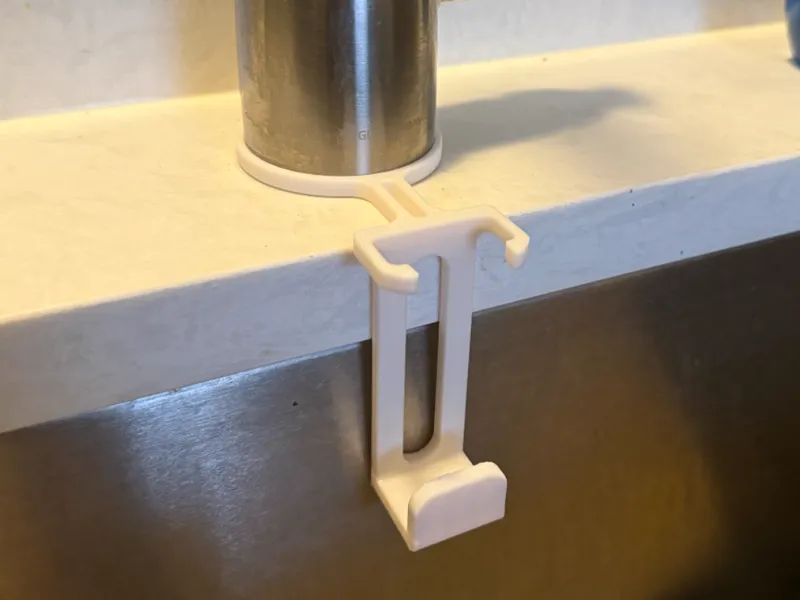 Minimalist sink caddy for sponge and Dishwand 