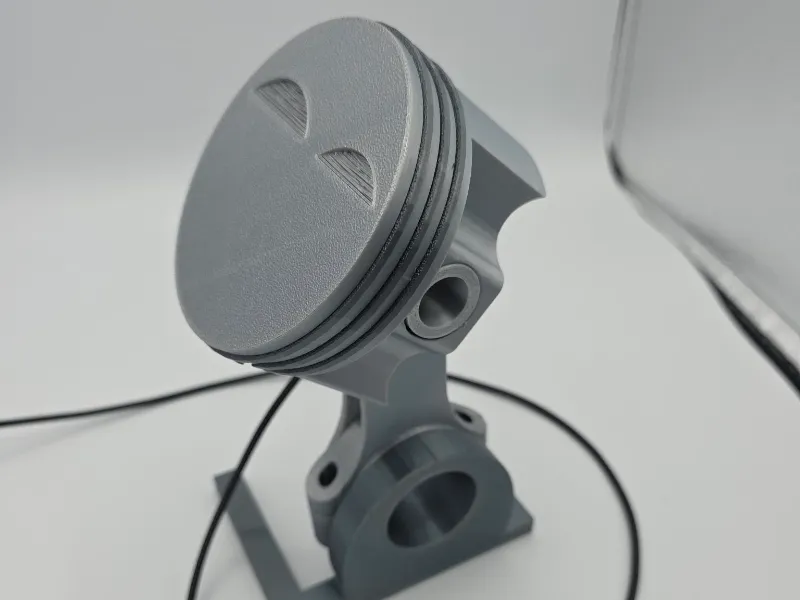 Piston Cellphone Charging Stand