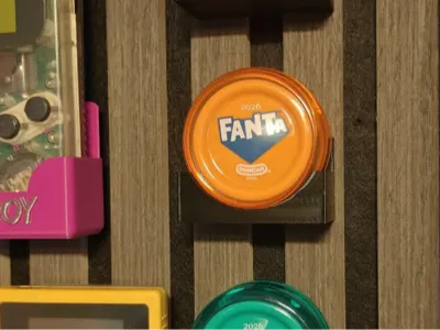 Yo-yo holder for acoustic panels