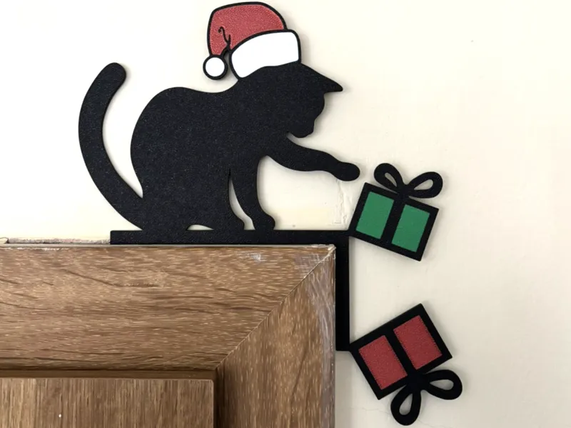 Christmas door corner with a cat and gifts