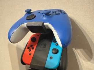 Wall-mounted controller and headset holder