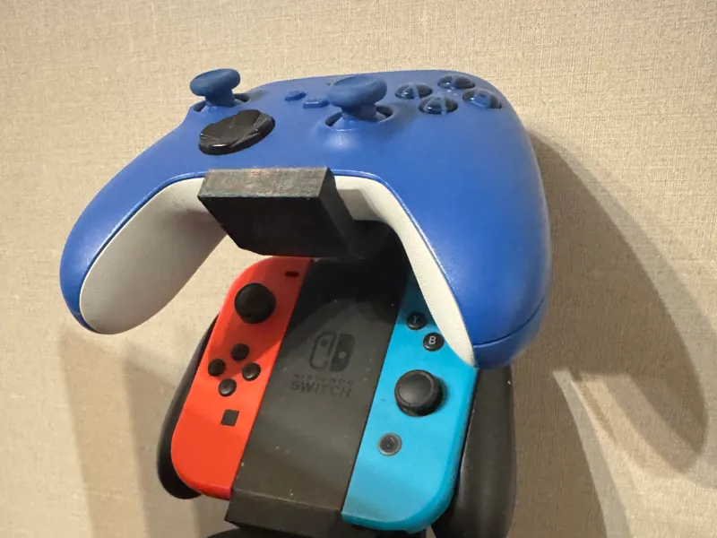 Wall-mounted controller and headset holder 