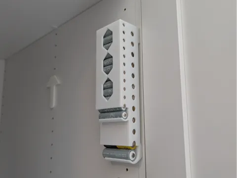 Soporte: Compact battery holder with IKEA mounting option — referencia de MakerWorld