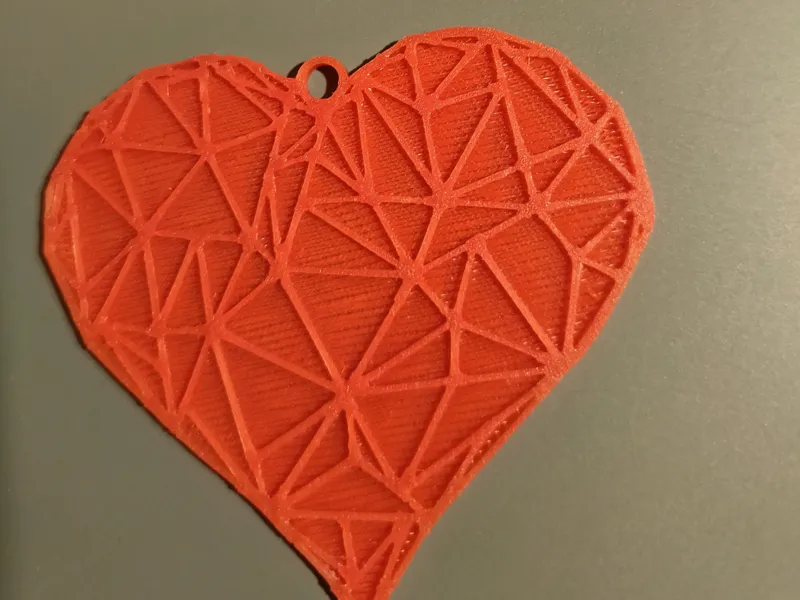Heart-shaped pendant with triangles