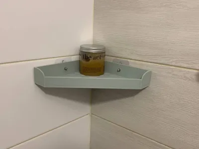Corner shower shelf