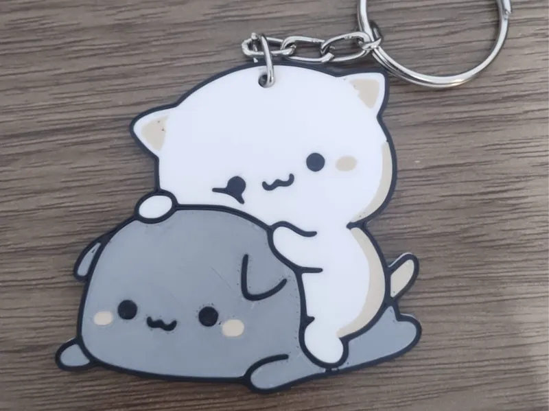 Llavero de gatitos felices
