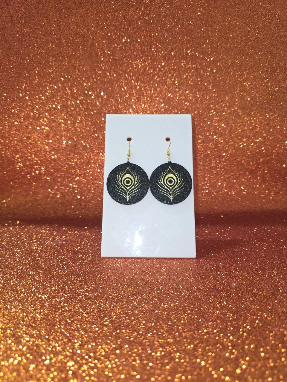 Golden peacock feather earrings view 2