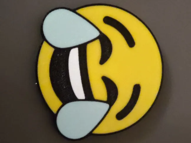 Emoji Die laughing with built-in magnet