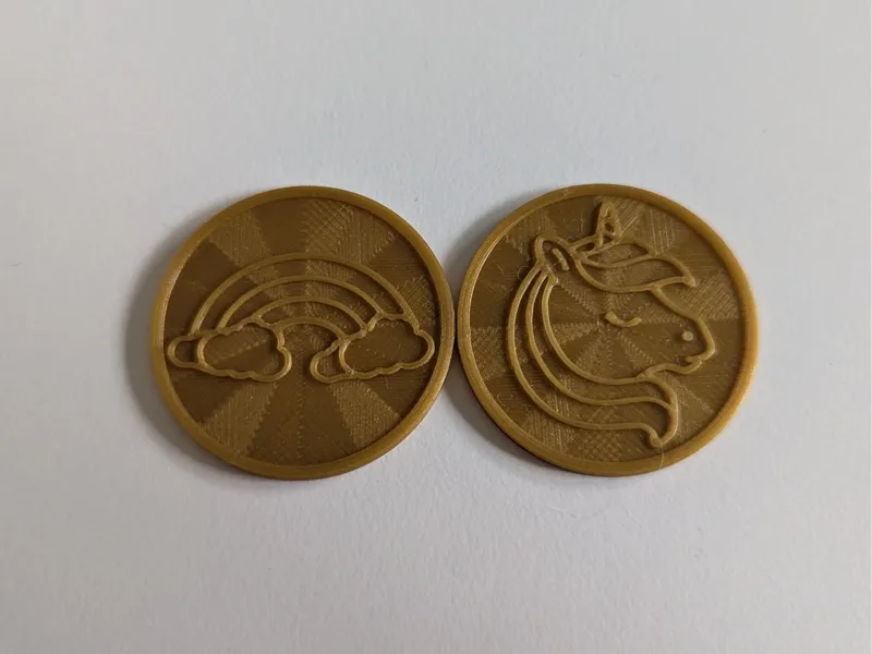 Toy Coins with a one and unicorn / rainbow