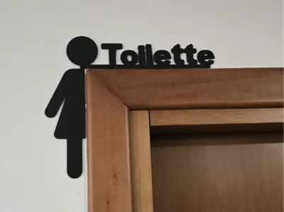 Women's Toilet above door decoration