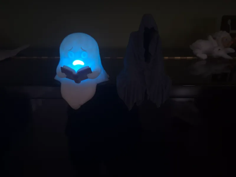 Halloween Ghost studying a creepy book