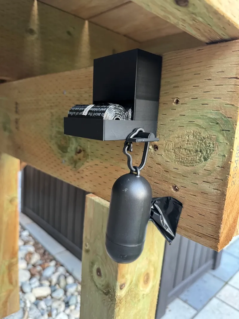 Poop bag dispenser with bag holder hook