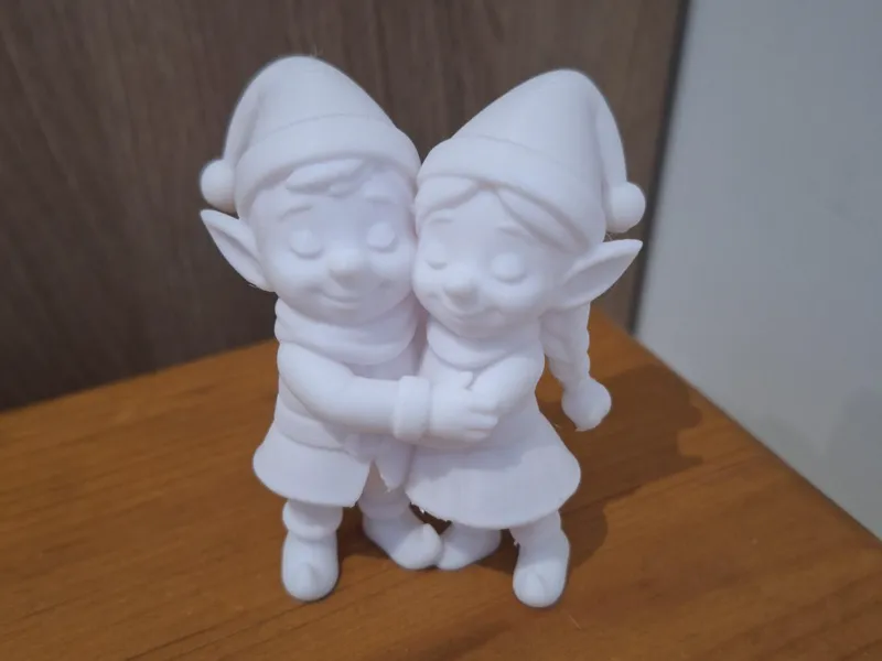 two hugging elves
