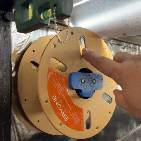 Self-locking filament spool holder