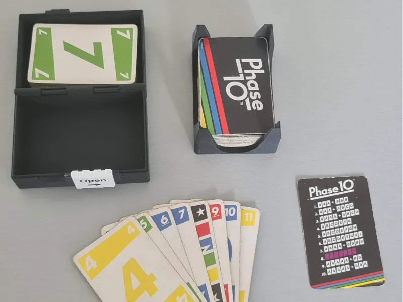 Storage box for Phase 10 with slide-lock mechanism