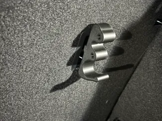 Isofix hook with hole for paracord storage